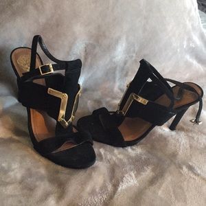 Black strapped sandals with gold detailing